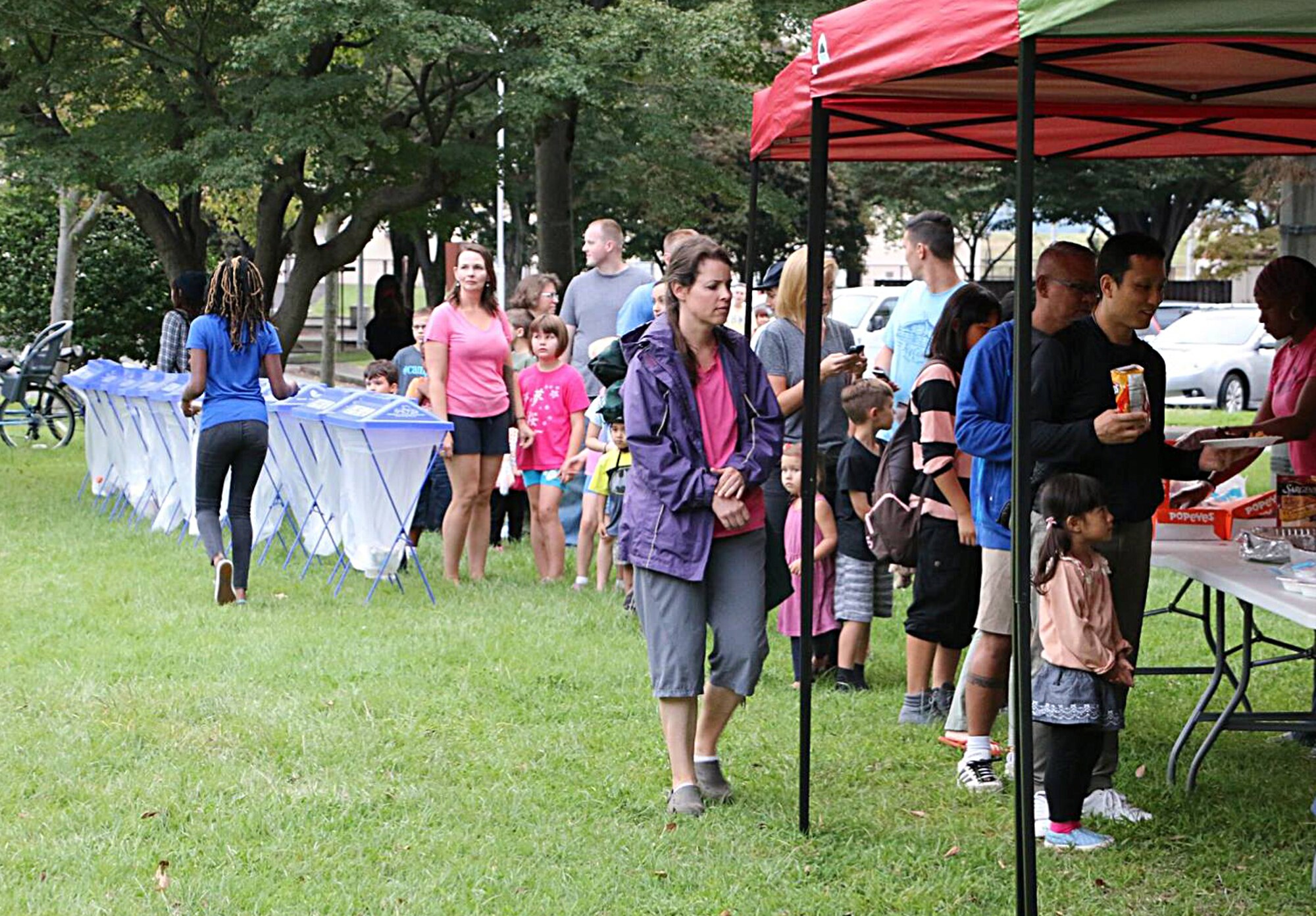 Members of the Yokota Community wait in line for food during the Sexual Assault Awareness Summer Series Concerts Sept. 26, 2015, at Yokota Air Base, Japan. More than 100 people came out to show their support, eat warm meals and listen to live music. (Courtesy photo)