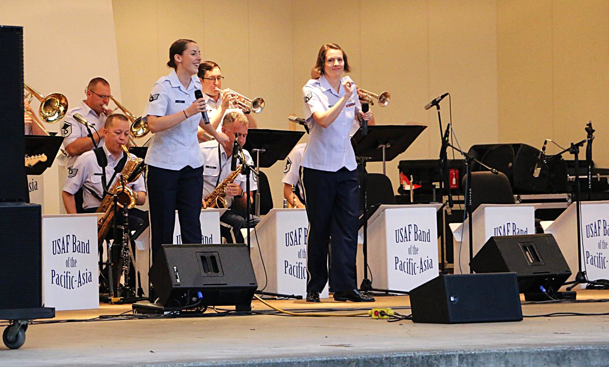 The Band of the Pacific-Asia plays live music to a crowd during the Sexual Assault Awareness Summer Series Concerts Sept. 26, 2015, at Yokota Air Base, Japan. The band was one of five that played at the concert to increase awareness regarding sexual assault and promote an assault-free community. (Courtesy photo)