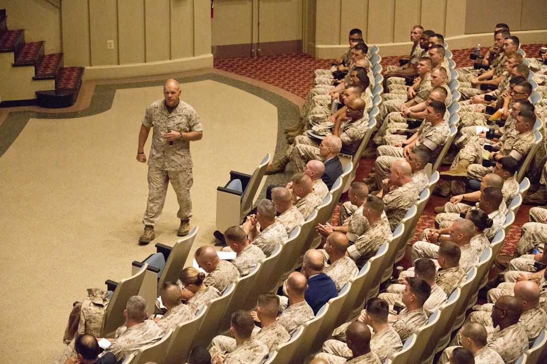 Commandant of the Marine Corps, Gen. Robert B. Neller, speaks to Marines with Training and Education Command, Marine Corps Combat Development Command, Combat Development and Integration at Little Hall, Marine Corps Base Quantico, Va., Oct. 1, 2015. Neller spoke about readiness, training, Naval integration, modernization and technology. (U.S. Marine Corps photo by Sgt. Gabriela Garcia/Released)