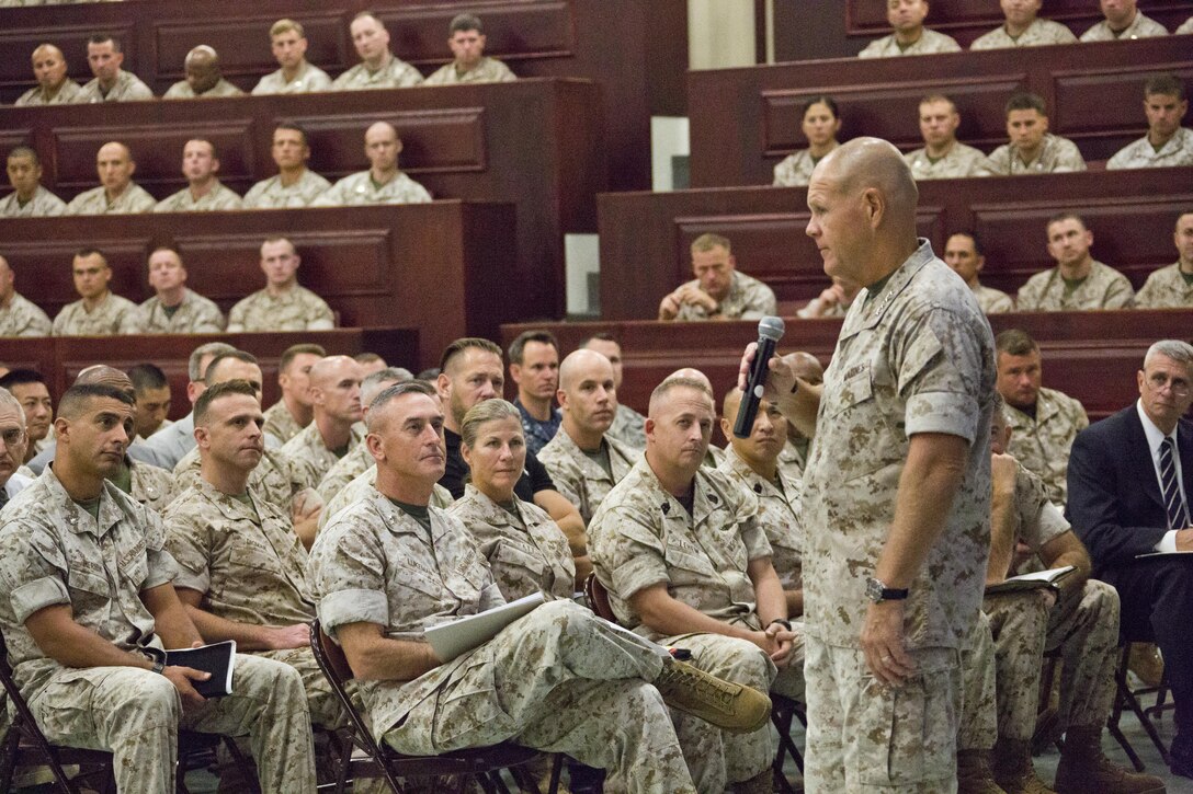 Commandant of the Marine Corps, Gen. Robert B. Neller, speaks to Marines with Marine Corps University at Ellis Hall, Marine Corps Base Quantico, Va., Oct. 1, 2015. Neller spoke about readiness, training, Naval integration, modernization and technology. (U.S. Marine Corps photo by Sgt. Gabriela Garcia/Released)