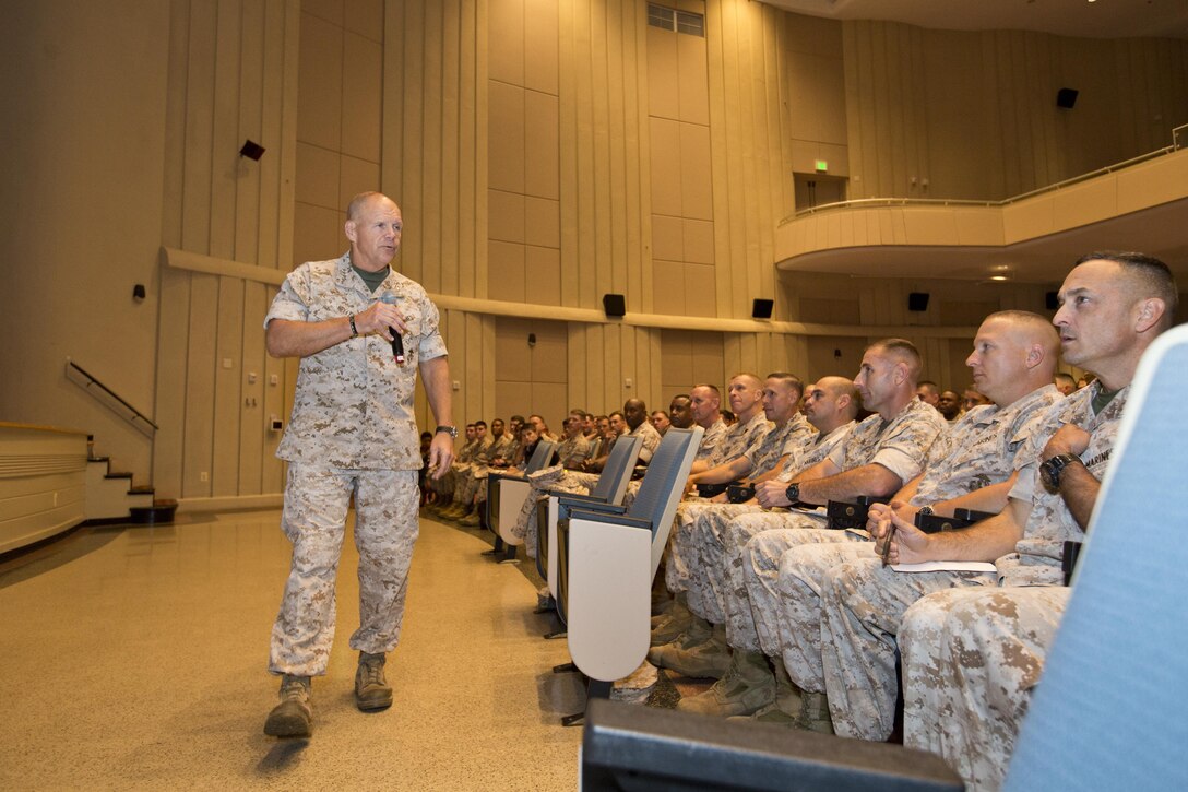 Commandant of the Marine Corps, Gen. Robert B. Neller, speaks to Marines, Navy Sailors and civilians at Little Hall, Marine Corps Base Quantico, Va., Oct. 1, 2015. Neller spoke about readiness, training, Naval integration, modernization and technology. (U.S. Marine Corps photo by Sgt. Gabriela Garcia/Released)
