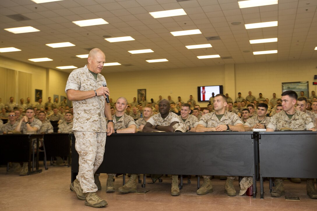 Commandant of the Marine Corps, Gen. Robert B. Neller, speaks to Marines with The Basic School at Heywood Hall, Marine Corps Base Quantico, Va., Oct. 1, 2015. Neller spoke about readiness, training, Naval integration, modernization and technology. (U.S. Marine Corps photo by Sgt. Gabriela Garcia/Released)