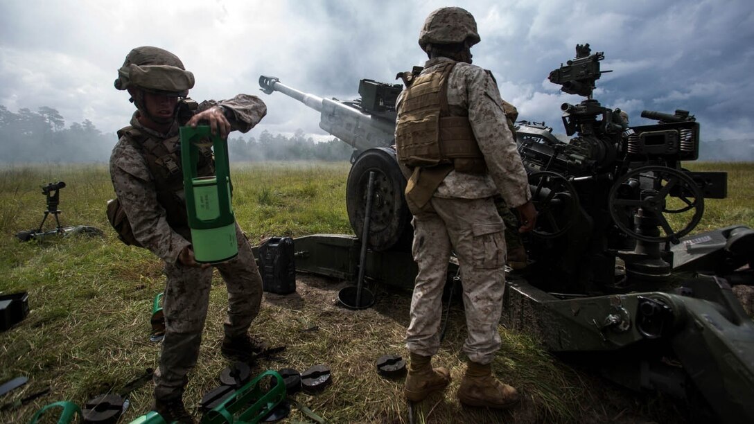 Lance Cpl. Brandon Such, field artillery cannoneer with Lima Battery, 2nd Battalion, 10th Marine Regiment, prepares powder increment to be used to fire an M777 Howitzer during a live-fire exercise at Marine Corps Base Camp Lejeune, North Carolina, Sept. 30, 2015. This was the last exercise Lima conducted as a standalone battery. 