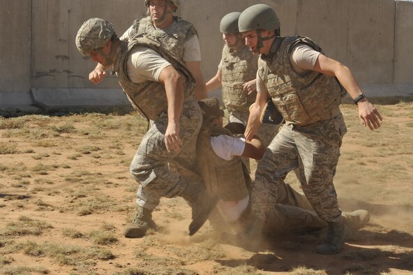 Emergency medical technicians from Hurlburt Field, Fla., evacuate a gunshot wound patient during a scenario at the EMT Rodeo Sept. 18, 2015, at Melrose Air Force Range, N.M. Twenty-one teams of EMTs from 22 installations across the Air Force convened at Cannon Air Force Base, N.M. for four days of innovative, high-octane competition Sept. 16-19.
 (U.S. Air Force photo/Tech. Sgt. Manuel J. Martinez)

