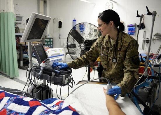Maj. Anjeli Nayar, a 455th Expeditionary Medical Operations Squadron intensive care unit general internist, simulates patient care on a hospital staff member Sept. 19, 2015, at Bagram Airfield, Afghanistan. Nayar is responsible for coordinating care for military members, defense civilians, civilian contractors, as well as some Afghan nationals, in the ICU at the Craig Joint Theater Hospital. (U.S. Air Force photo/Senior Airman Cierra Presentado)
