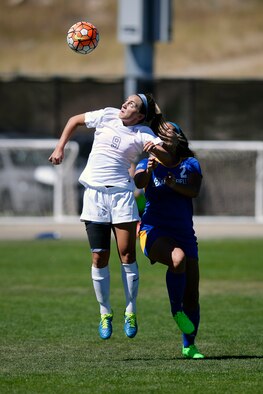 Brooke Rittmann, a U.S. Air Force Academy sophomore, goes up for the header against  a player from California State University, Bakersfield, at the Academy's Cadet Soccer Stadium in Colorado Springs, Colo., Sept. 20, 2015. The Falcons dropped the nonconference match 2-1. (Air Force photo/Mike Kaplan)