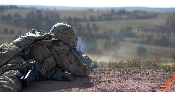 Airman Kaylee Morin, assigned to the 90th Missile Wing at F.E. Warren Air Force Base, Wyo., fires at a target Sept. 23, 2015, during a shooting portion of the 2015 Global Strike Challenge security forces competition on Camp Guernsey, Wyo. The final portion of the shooting course had Airmen locate and shoot at targets distanced between 200 and 600 meters. (U.S. Air Force photo/Senior Airman Brandon Valle)
