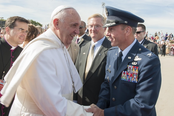 Col. Brad Hoagland, the Joint Base Andrews commander, greets Pope Francis on the base flightline Sept. 24, 2015. The pope visited New York and Philadelphia during his U.S. trip before returning to Rome Sept. 27. (U.S. Air Force photo/Tech. Sgt. Robert Cloys)