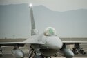 An F-16 Fighting Falcon pilot assigned to the 555th Expeditionary Fighter Squadron goes through a preflight inspection before a combat sortie at Bagram Airfield, Afghanistan, Sept. 22, 2015. The F-16 is a multi-role fighter aircraft that is highly maneuverable and has proven itself in air-to-air and air-to-ground combat. (U.S. Air Force photo/Tech. Sgt. Joseph Swafford)