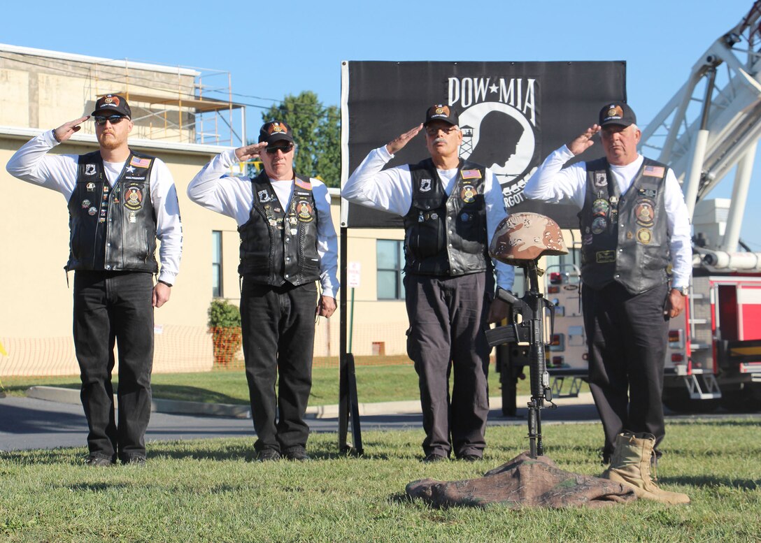 Post 143’s American Legion Riders performs a Field Cross Ceremony in recognition of POW/MIA. (Photo by Gregory Crouse, FMWR)