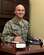 U.S. Air Force Capt. Adam Crane, 97th Air Mobility Wing Deputy Inspector General of complaints and resolution poses at his desk, Sept. 29, 2015. The Inspector General Complaints and Resolution department works to enhance mission effectiveness, morale and productivity through complaint resolution and fraud, waste and abuse prevention. (U.S. Air Force photo by Airman 1st Class Megan E. Acs/Released) 