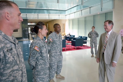 Rep. Lamar Smith (right) speaks to (from left) Sgt. 1st Class Allen Armstrong, Capt. Kelly Elminger and Staff Sgt. Robert Green during the “Day in the Life of a Warrior Transition Battalion Soldier” visit at the Center for Intrepid Sept. 4.