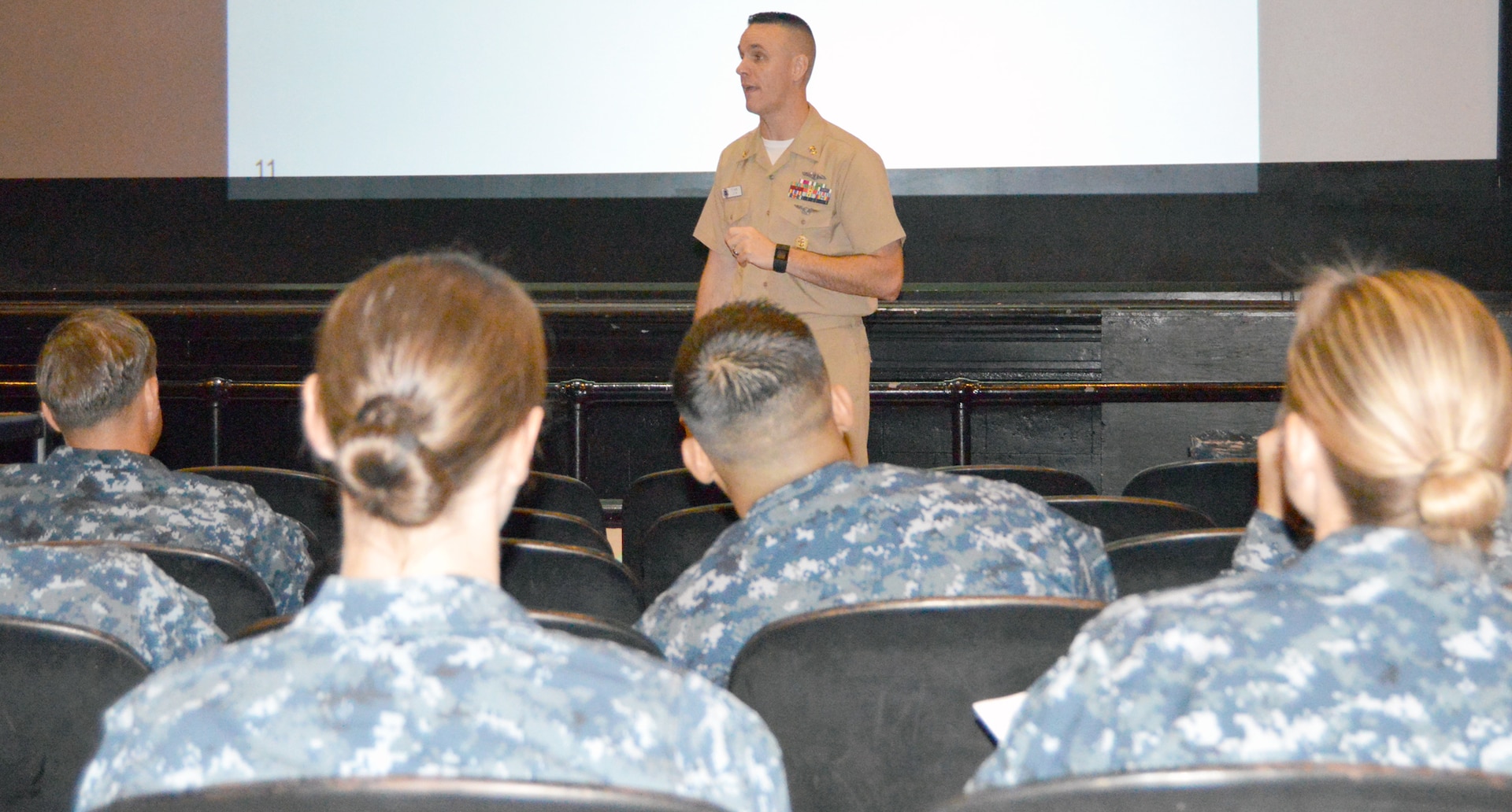 Command Master Chief Petty Officer Rich Curtis, director of the U.S. Navy Senior Enlisted Academy in Newport, R.I, speaks to San Antonio area chief petty officers at the Joint Base San Antonio-Randolph main auditorium as part of a 10-city, 24-day whirlwind tour of Navy fleet-concentration areas.  There are more than 10,000 active duty, reserve and student Navy Sailors, civilian employees and family members in the San Antonio area.