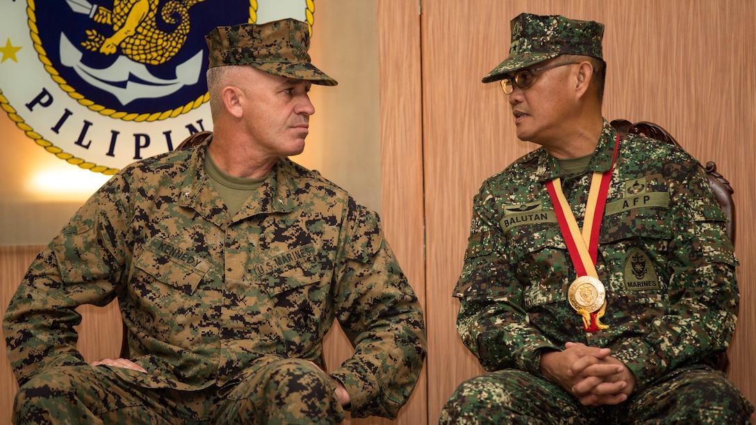 U.S. Marine Corps Brig. Gen. Paul J. Kennedy, 3rd Marine Expeditionary Brigade, commanding general, left, speaks with Philippine Marine Corps Maj. Gen. Alexander F. Balutan,  Armed Force Philippines, Naval Inspector General, during the opening ceremony for Amphibious Landing Exercise 2015 (PHIBLEX 15) at the Philippine Marine Corps Base in Fort Bonifacio, Taguig City, Philippines, Oct. 1, 2015. PHIBLEX 15 is an annual, bilateral training exercise conducted by U.S. Marine and Navy Forces with the Armed Forces of the Philippines in order to strengthen our interoperability and working relationships across the range of military operations from disaster relief, to complex expeditionary operations. 