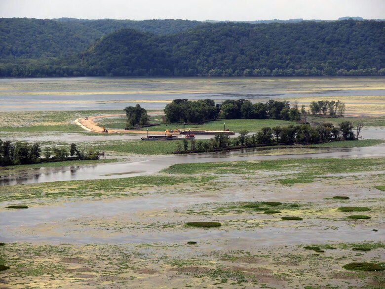 View from the Wisconsin bluff of Island L1 under construction. Once completed, the new island will help protect an existing island, while the backwater area between the islands will provide new habitat for wildlife.