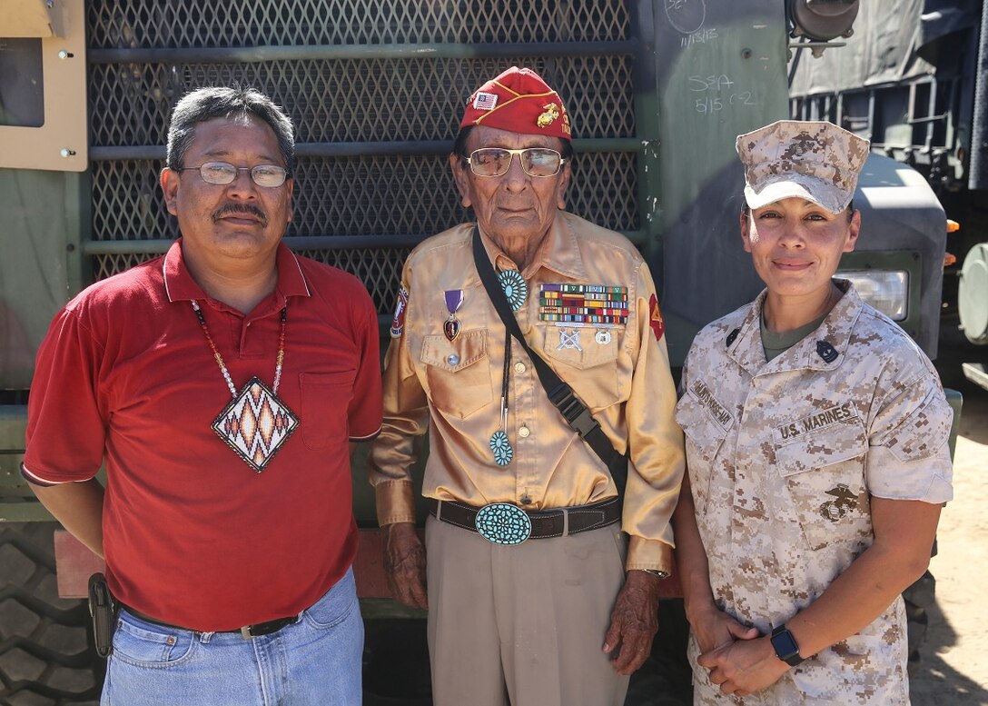 Navajo Code Talker Samuel T. Holiday poses with his son, Ricky Gray, and 1st Sgt. Christina Hunts Horse-May, first sergeant for Company C, 9th Communication Battalion, I Marine Expeditionary Force Headquarters Group, during a visit to a static display held by 9th Comm. Bn. aboard Marine Corps Base Camp Pendleton, Calif., Sept. 28, 2015. The visit allowed for the Marines to showcase their communications capabilities and build a bond between them and the Code Talkers. (U.S. Marine Corps photo by Pfc. Devan K. Gowans)