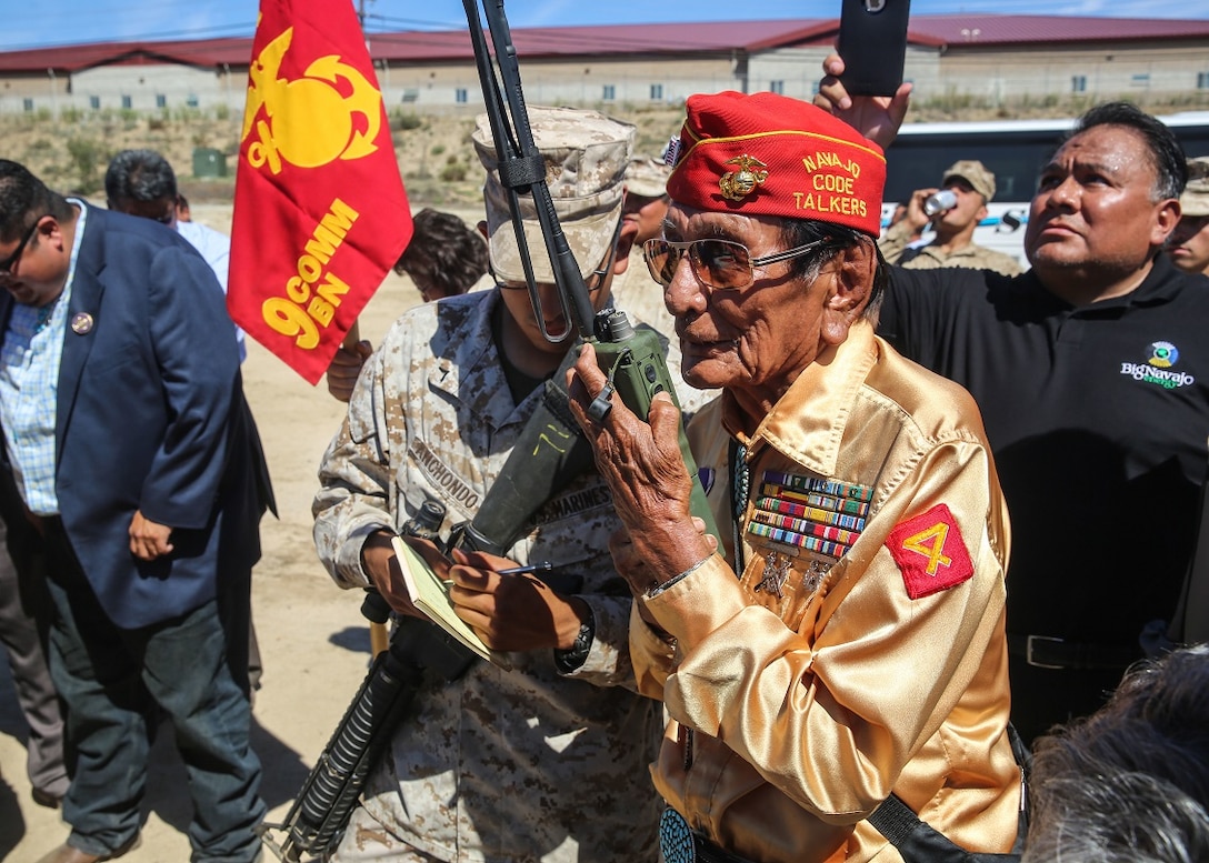 Navajo Code Talker Samuel T. Holiday relays a message in Navajo to fellow Code Talker Roy Hawthorne, during a visit to a static display held by 9th. Communication Battalion, I Marine Expeditionary Force Headquarters Group, aboard Marine Corps Base Camp Pendleton, Sept. 28, 2015. The visit allowed for the Marines to showcase their communication capabilities and build a bond between them and the Code Talkers. (U.S. Marine Corps photo by Pfc. Devan K. Gowans)