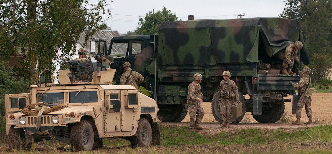 U.S. soldiers receive an ammunition and fuel resupply during training Exercise King Strike in Panevezys, Lithuania, Sept. 22, 2015. U.S. Army photo by Sgt. Jarred Woods