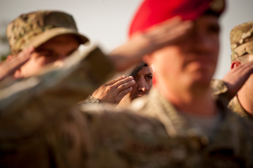 Members of the 26th Special Tactics Squadron salute during the National Anthem at a retreat ceremony dedicated to the memory of Senior Airman Mark Forester, Sept. 29, 2015 at Cannon Air Force Base, N.M. Forester was a Special Tactics combat controller who coordinated close air support for special operations teams in hostile environments. Forester was killed in action when he put himself in direct line of fire to save a teammate’s life in Afghanistan on Sept. 29, 2010. He posthumously received the Silver Star medal for his heroism in battle against an enemy of the United States. (U.S. Air Force photo/Tech. Sgt. Manuel J. Martinez)