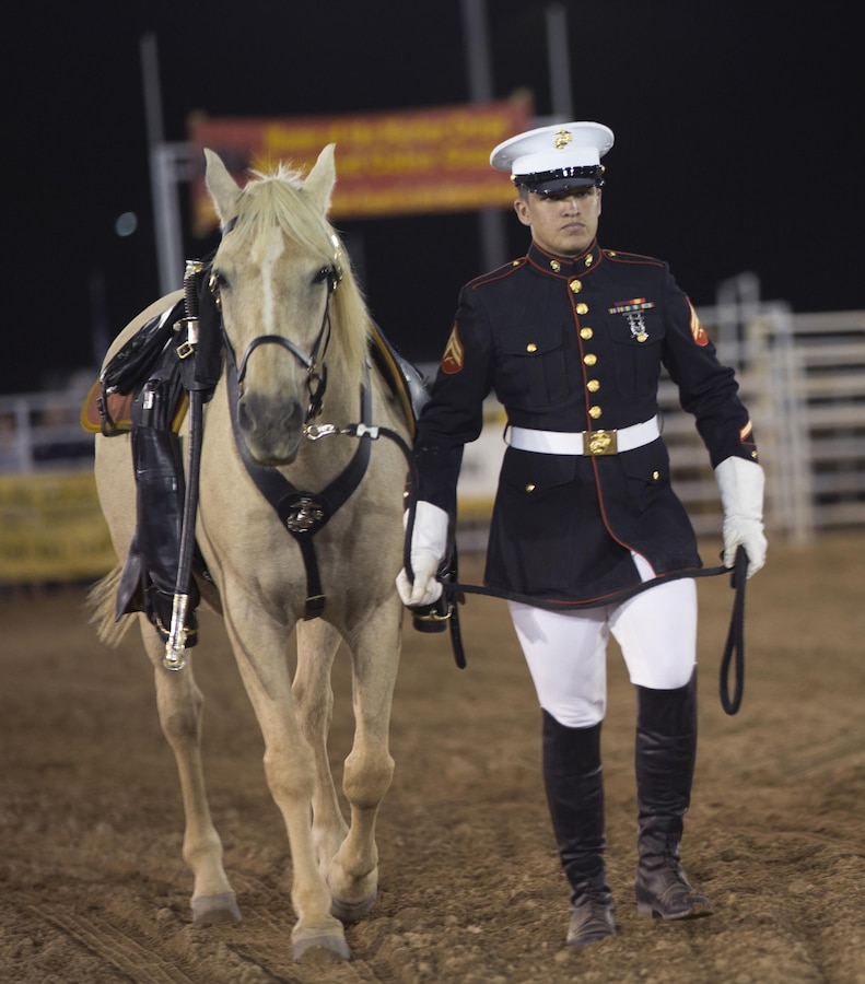 Cpl. Miguel Felix leades the riderless horse into the area during opening cermonies of the 2015 Barstow Rodeo Stampede, held aboard Marine Corps Logistics Base Barstow on Sept. 25.
