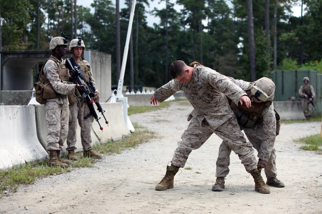 Lance Cpl. Tyler, Shiels, right, conducts a search of Cpl. Kyle Lamprich during a security forces training exercise at Marine Corps Base Camp Lejeune, N.C., Sept. 30, 2015. More than 30 Marines with 2nd Low Altitude Air Defense Battalion participated in the week-long training, covering a full spectrum of scenarios they may encounter while deployed. Shiels and Lamprich are both low altitude air defense gunners with the squadron. (U.S. Marine Corps photo by Lance Cpl. Jason Jimenez/Released)