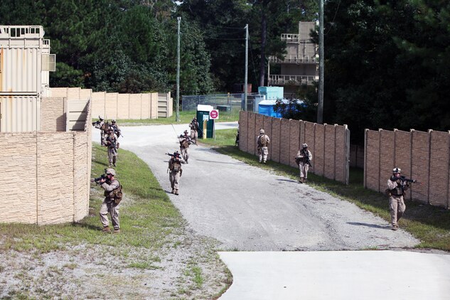 Marines patrol during a security forces training exercise at Marine Corps Base Camp Lejeune, N.C., Sept. 30, 2015. More than 30 Marines with 2nd Low Altitude Air Defense Battalion participated in the week-long training, covering a full spectrum of scenarios they may encounter while deployed. The Marines are all low altitude air defense gunners with the battalion. (U.S. Marine Corps photo by Lance Cpl. Jason Jimenez/Released)