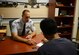 Tech Sgt. Keith Hassell, a line recruiter at Tinker Air Force Base, Oklahoma, works on enlistiing one of the more than 8,000 accessions gainned by Air Force Reserve Recruiting Service in fiscal year 2015. Reserve Recruiting Service has met or exceeded their recruiting accession goal for 15 consecutive years. (Air Force photo/Master Sgt. Chance Babin)