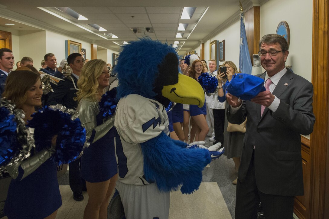 The U.S. Air Force Academy mascot presents Defense Secretary Ash Carter with an Air Force hat during a pep rally at the Pentagon, Oct. 2, 2015. DoD photo by U.S. Air Force Senior Master Sgt. Adrian Cadiz
