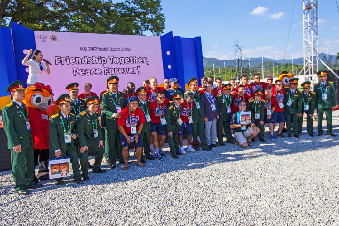 U.S. Men’s soccer team pose for pictures with Vietnamese athletes during the 2015 CISM Military World Games in Mungyeong, South Korea., Sept. 29, 2015.  U.S. Marine Corps photo by Sgt. Ashley Cano