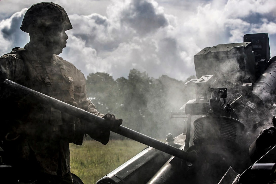 Marine Corps Cpl. Anthony Payton swabs an M777 Howitzer after it was fired during a live-fire exercise on Camp Lejeune, N.C., Sept. 30, 2015. Payton is a field artillery cannoneer with Lima Battery, 2nd Battalion, 10th Marine Regiment, This was the last exercise the unit conducted as a standalone battery. U.S. Marine Corps photo by Cpl. Kirstin Merrimarahajara