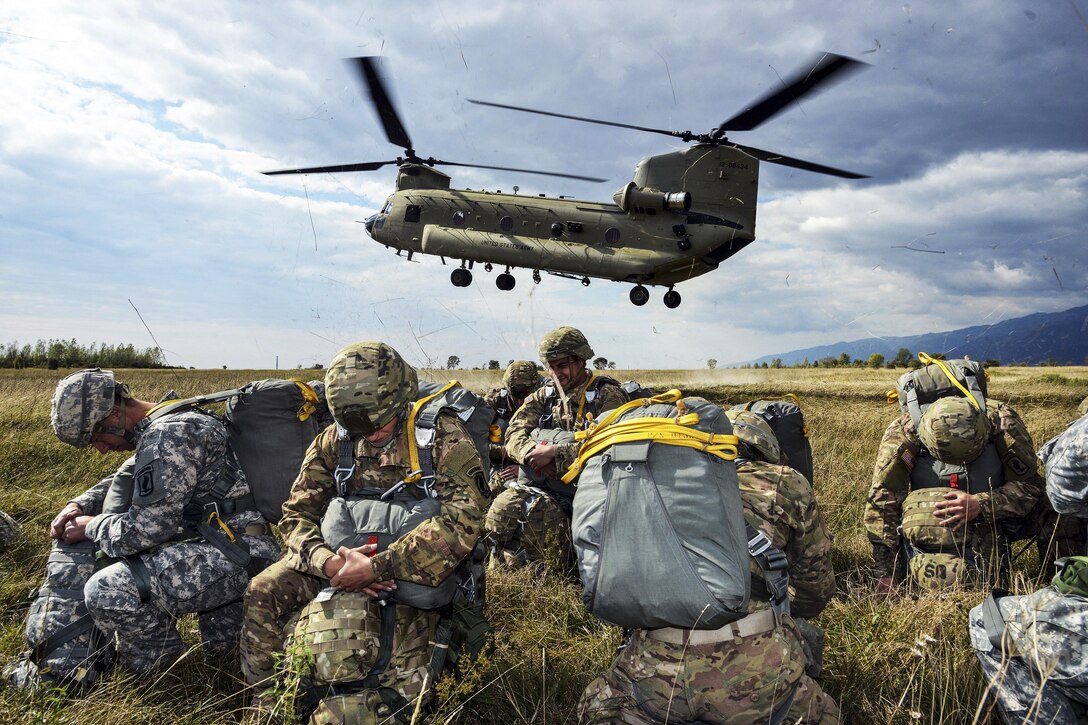 U.S. paratroopers prepare to board a U.S. Army CH-47 Chinook helicopter for an airborne operation at Juliet drop zone in Pordenone, Italy, Sept. 30, 2015. The paratroopers are assigned to the 173rd Brigade Support Battalion, 173rd Airborne Brigade. U.S. Army photo by Paolo Bovo