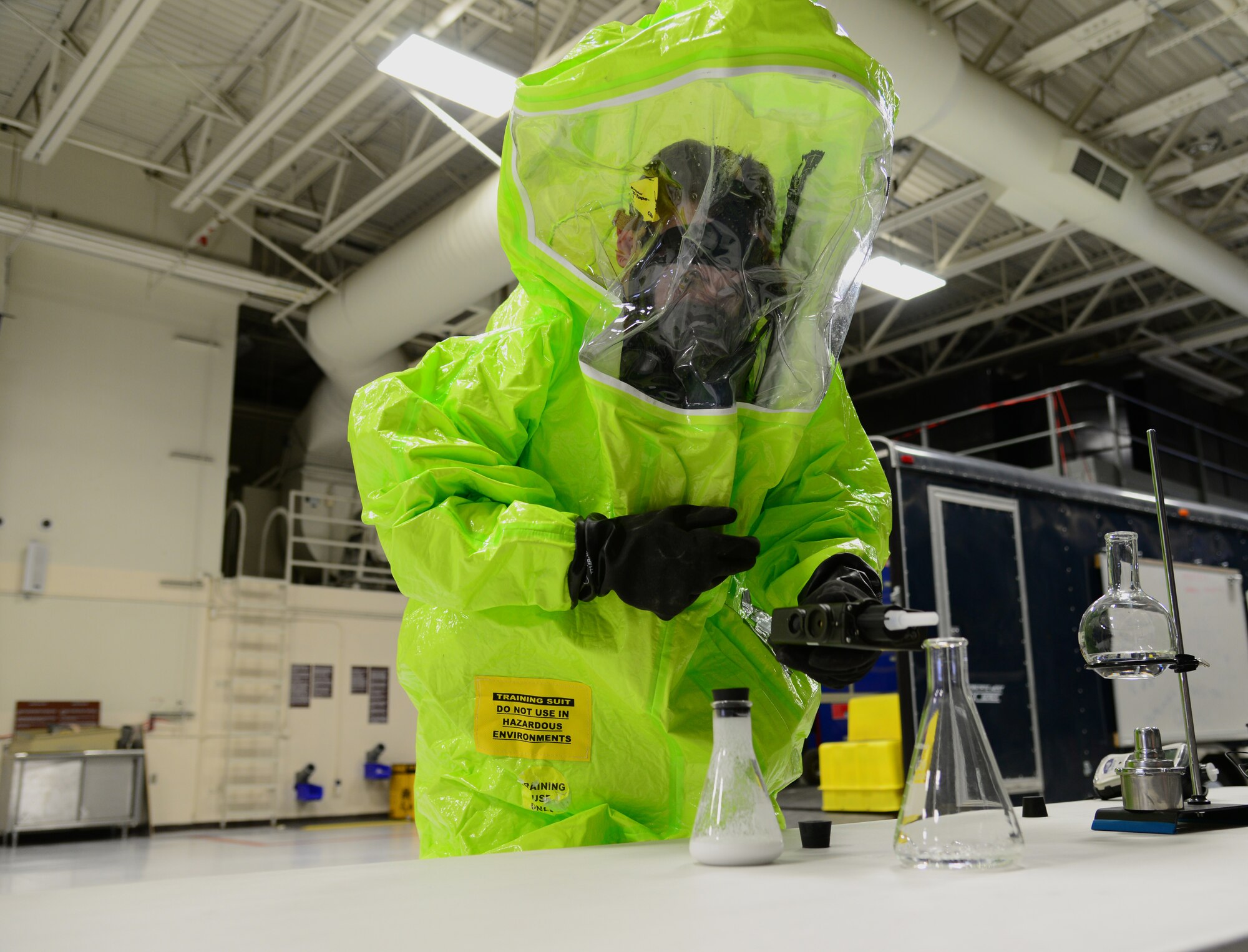 U.S. Air Force Senior Airman Sean Kirby, a 354th Civil Engineer Squadron emergency management journeyman, wears a hazardous materials training suit Sep. 29, 2015, at Eielson Air Force Base, Alaska. Kirby was demonstrating techniques to gain presumptive identification of an unknown chemical. (U.S. Air Force photo by Airman 1st Class Cassandra Whitman/Released)