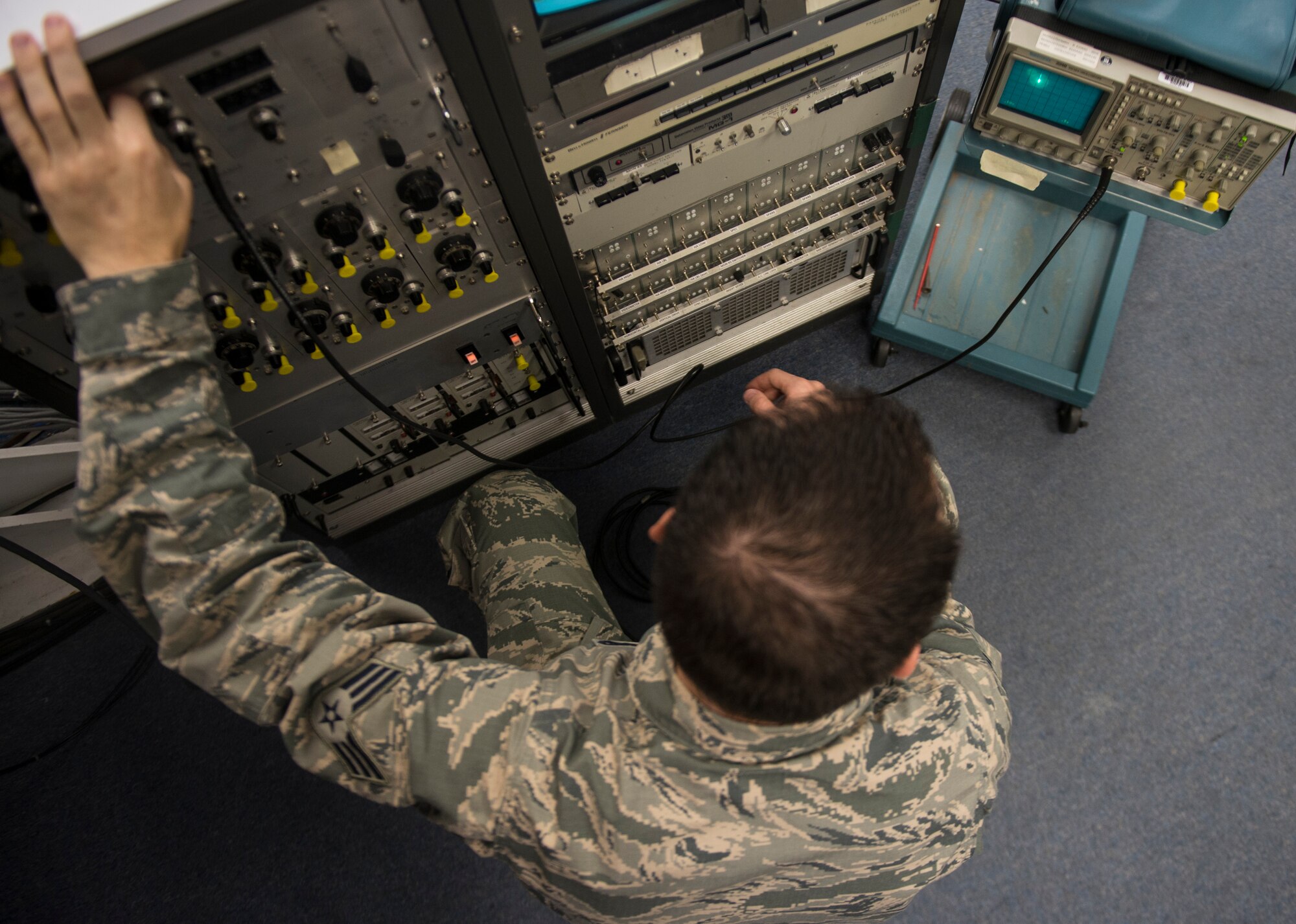 Senior Airman Samuel Davis, an airfield systems maintenance apprentice with the 2nd Weather Squadron, Det. 4, checks incoming and outgoing signals as part of routine preventative maintenance at the Holloman Solar Observatory on Sept. 24. Davis monitors video and checks signals to make sure everything is within the correct parameters. He also makes small adjustments to keep the telescopes running smoothly. (U.S. Air Force photo by Senior Airman Aaron Montoya)