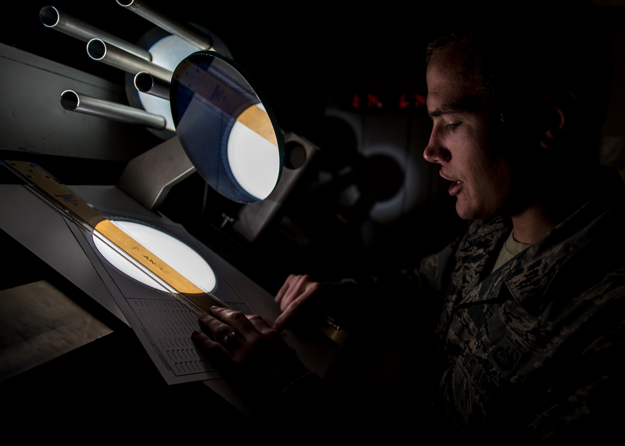 Staff Sgt. Erin O’Connell, a solar analyst with the 2nd Weather Squadron, Det. 4, creates a sunspot drawing from a projected image of the sun at the Holloman Solar Observatory on Sept. 24. Sunspots are temporary phenomena on the visible surface of the sun that appear visibly as dark spots compared to surrounding regions. The solar analysts closely monitor this information in order to safeguard and protect important assets in both civilian and Department of Defense agencies. (U.S. Air Force photo by Senior Airman Aaron Montoya)