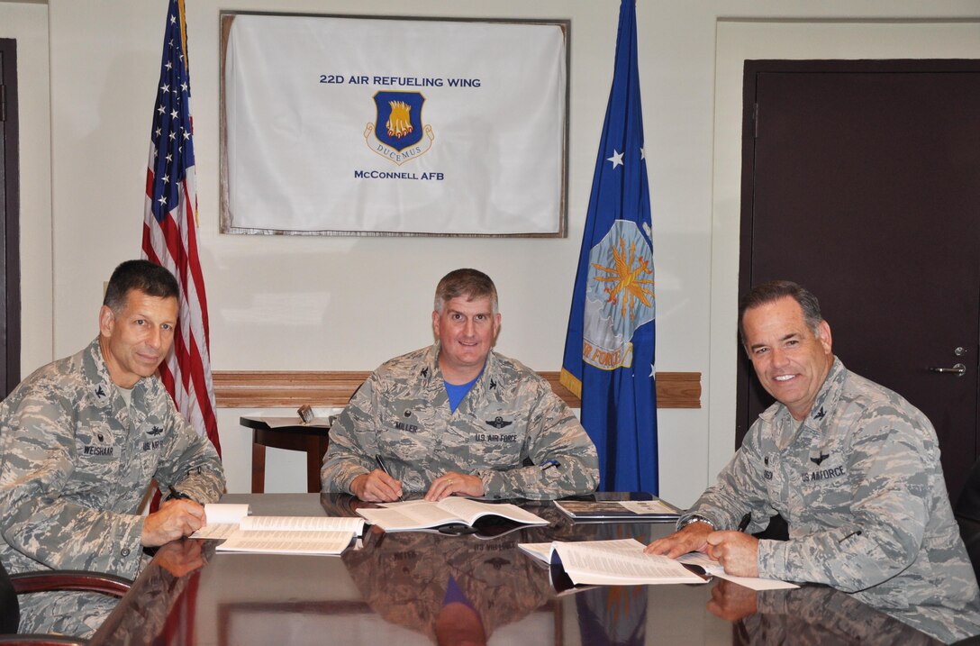 (Left to right) Col. David Weishaar, 184th Mission Support Group commander, Col. Albert Miller, 22nd Air Refueling Wing commander, and Col. Mark S. Larson, 931st Air Refueling Group commander, sign their Combined Federal Campaign donations, Oct. 02, 2015, McConnell Air Force Base, Kan. The CFC is a fundraising campaign targeted at federal employees, and gives them the opportunity to donate to various charities. (U.S. Air Force photo by Tech. Sgt. Abigail Klein)
