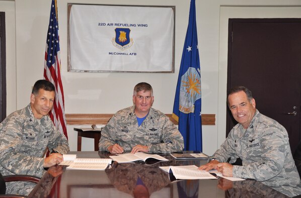 (Left to right) Col. David Weishaar, 184th Mission Support Group commander, Col. Albert Miller, 22nd Air Refueling Wing commander, and Col. Mark S. Larson, 931st Air Refueling Group commander, sign their Combined Federal Campaign donations, Oct. 02, 2015, McConnell Air Force Base, Kan. The CFC is a fundraising campaign targeted at federal employees, and gives them the opportunity to donate to various charities. (U.S. Air Force photo by Tech. Sgt. Abigail Klein)
