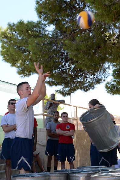 Airmen play basketball-pong during Wingman Day 2015 at Luke Air Force Base, Sep. 30, 2015. Through Wingman Day, Luke Airmen engaged in a wide variety of athletic and recreational competitions designed to strengthen wingmanship and morale. (U.S. Air Force photo by Airman 1st Class Ridge Shan)
