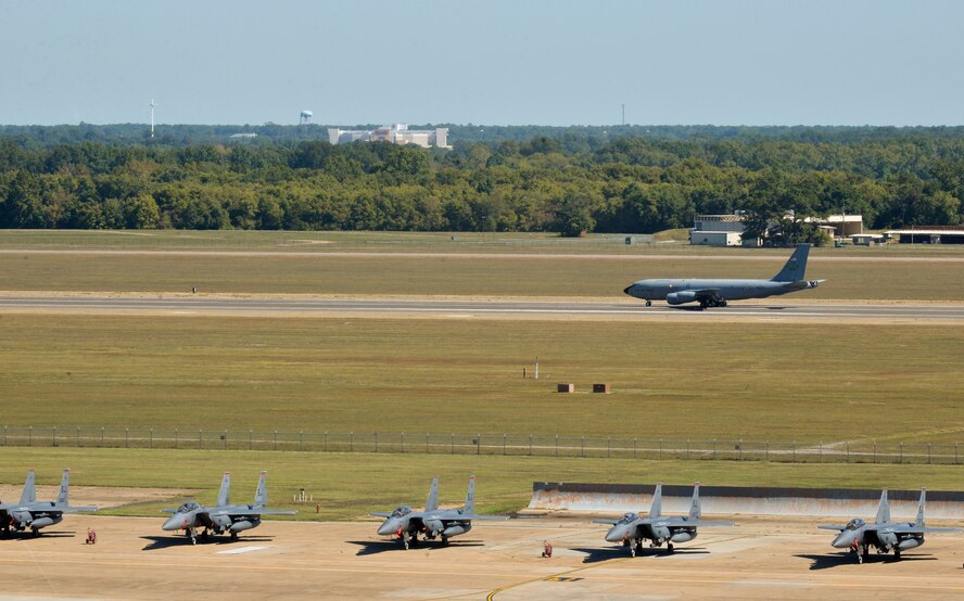 A KC-135 Stratotanker and F-15E Strike Eagles share the flightline at Barksdale Air Force Base, La., Oct. 2, 2015. Hundreds of aircrew and more than 65 aircraft from Seymour Johnson AFB, N.C., relocated to avoid potential damage from high winds associated with Hurricane Joaquin along the East Coast. (U.S. Air Force photo/Airman 1st Class Mozer O. Da Cunha)