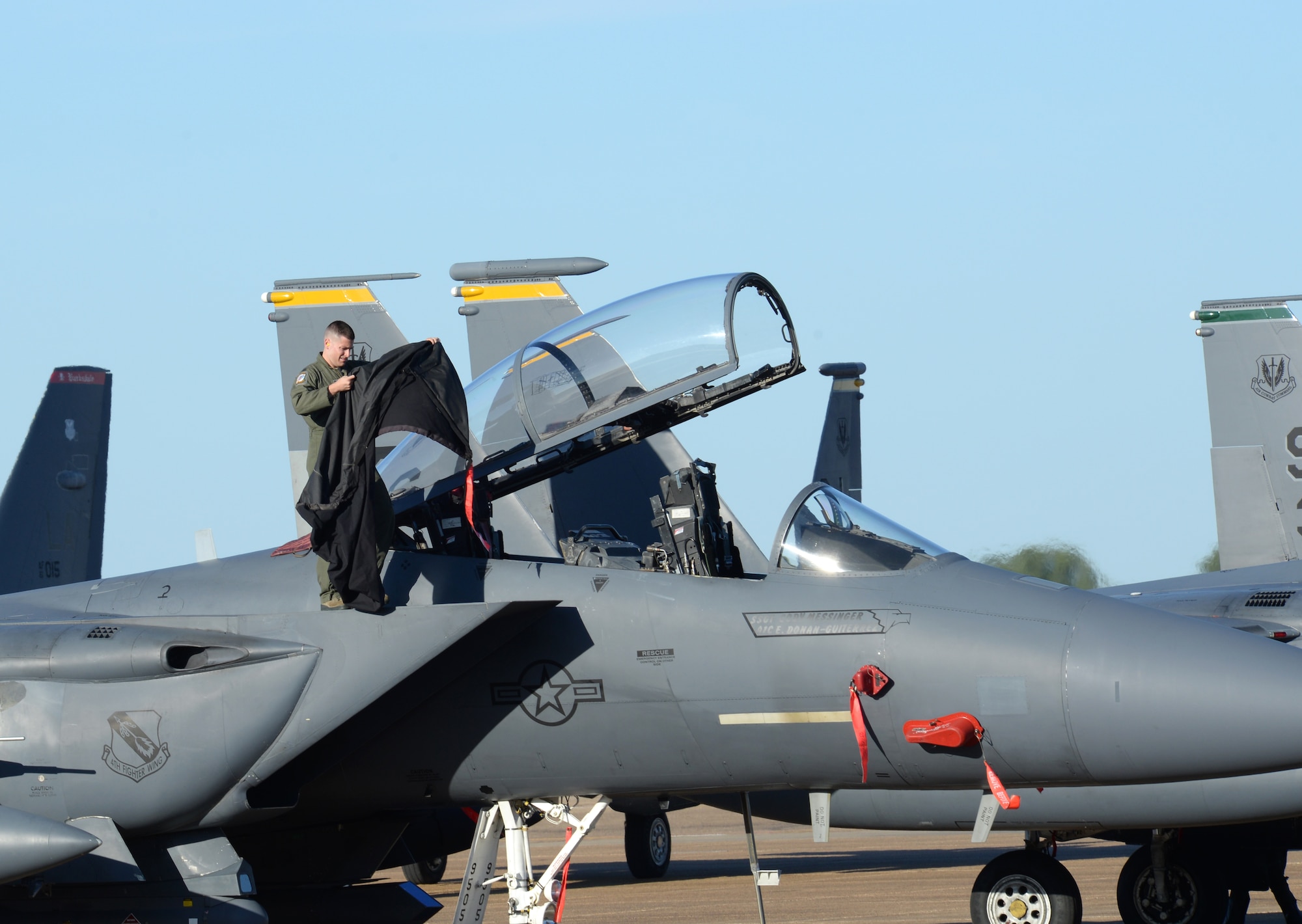 An Airman performs post-flight procedures on an F-15E Strike Eagle at Barksdale Air Force Base, La., Oct. 1, 2015. Fighter and refueler aircraft from the 916th Air Refueling Wing and the 4th Fighter Wing of Seymour Johnson AFB, N.C., shared the flightline amid Hurricane Joaquin concerns. (U.S. Air Force photo/Airman 1st Class Curt Beach)