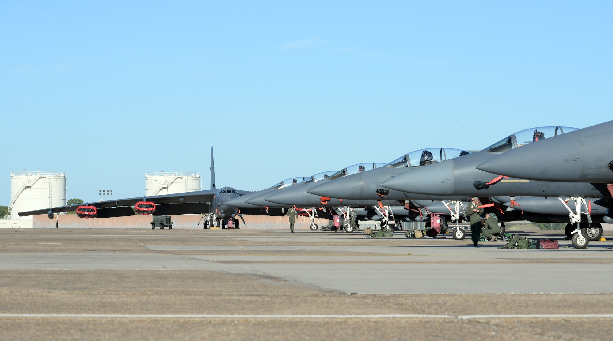 A B-52 Stratofortress and F-15E Strike Eagles share the flightline at Barksdale Air Force Base, La., Oct. 1, 2015. More than 65 aircraft from Seymour Johnson AFB, N.C., were relocated to avoid potential damage from Hurricane Joaquin along the East Coast. (U.S. Air Force photo/Airman 1st Class Curt Beach)