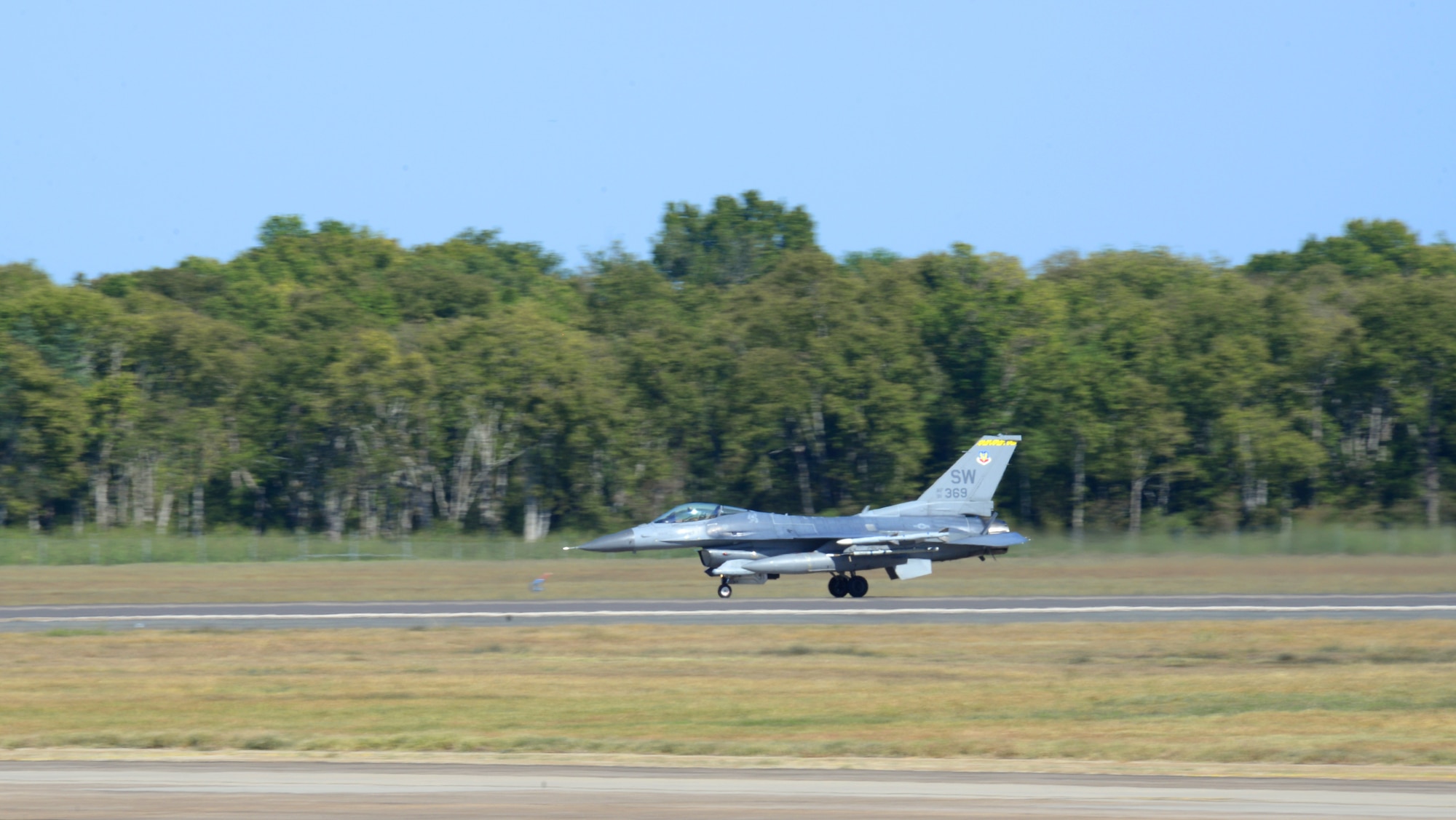 An F-16 Fighting Falcon lands on the flightline at Barksdale Air Force Base, La., Oct. 1, 2015. In an air combat role, the F-16's maneuverability and combat radius (distance it can fly to enter air combat, stay, fight and return) exceed that of all potential threat fighter aircraft. It can locate targets in all weather conditions and detect low flying aircraft in radar ground clutter. In an air-to-surface role, the F-16 can fly more than 500 miles (860 kilometers), deliver its weapons with superior accuracy, defend itself against enemy aircraft, and return to its starting point. An all-weather capability allows it to accurately deliver ordnance during non-visual bombing conditions. (U.S. Air Force photo/Airman 1st Class Curt Beach)