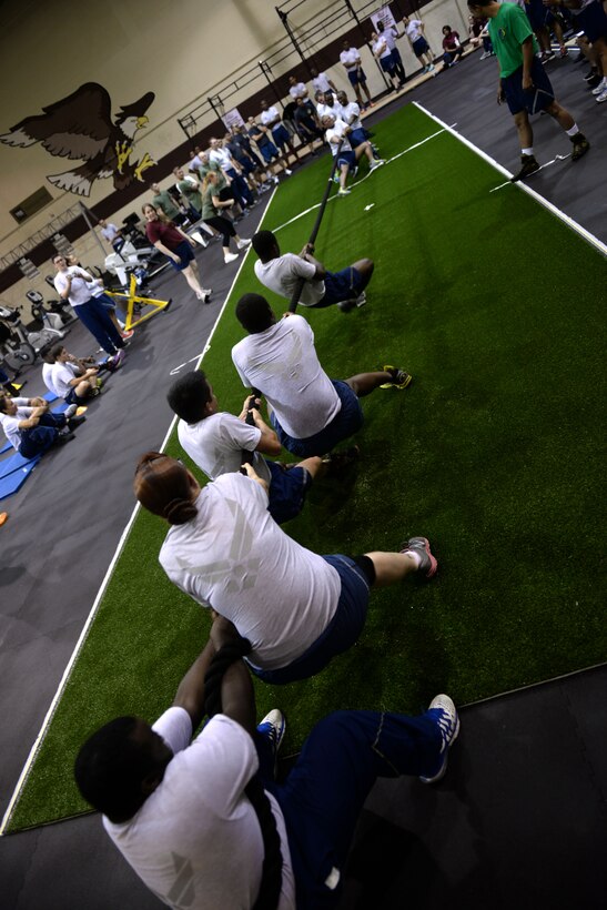 Team Seymour Airmen participate in a game of tug-of-war during Comprehensive Airmen Fitness Day, Sept. 30, 2015, at Seymour Johnson Air Force Base, North Carolina. Tug-of-war was one of several events held for CAF Day, which was designed to promote the physical pillar of CAF and enhance squadron morale. (U.S. Air Force photo/Airman 1st Class Ashley Williamson)