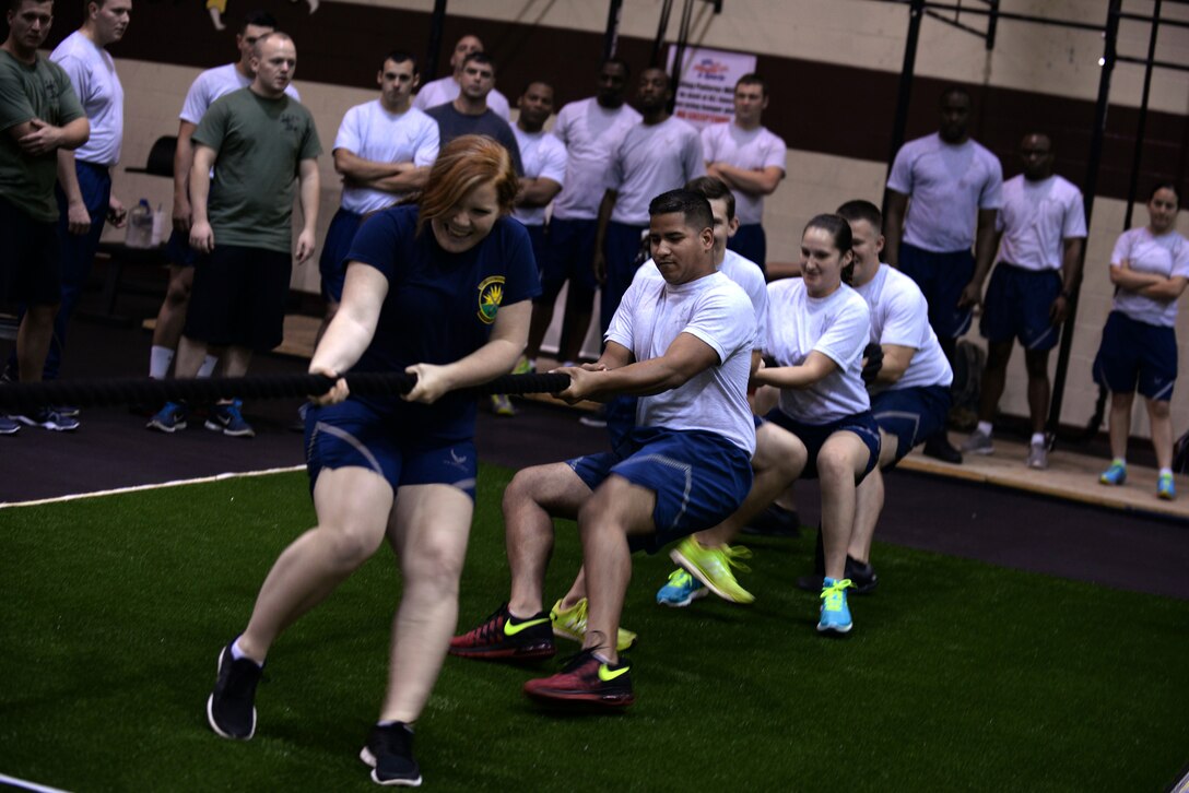 A team of Airmen battle in a game of tug-of-war during Comprehensive Airman Fitness Day, Sept. 30, 2015, at Seymour Johnson Air Force Base, North Carolina. For each first, second and third place finish in an event, teams earned points for their squadron to see which would reign supreme. (U.S. Air Force photo/Airman 1st Class Ashley Williamson)