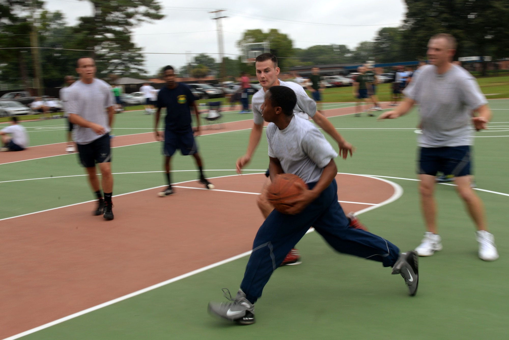 Team Seymour Airmen play a game of 3-on-3 basketball during Comprehensive Airman Fitness Day, Sept. 30, 2015, at Seymour Johnson Air Force Base, North Carolina. More than 100 Airmen participated in the tournament to earn points for their squadron and see who would be crowned champion. (U.S. Air Force photo/Airman 1st Class Ashley Williamson)