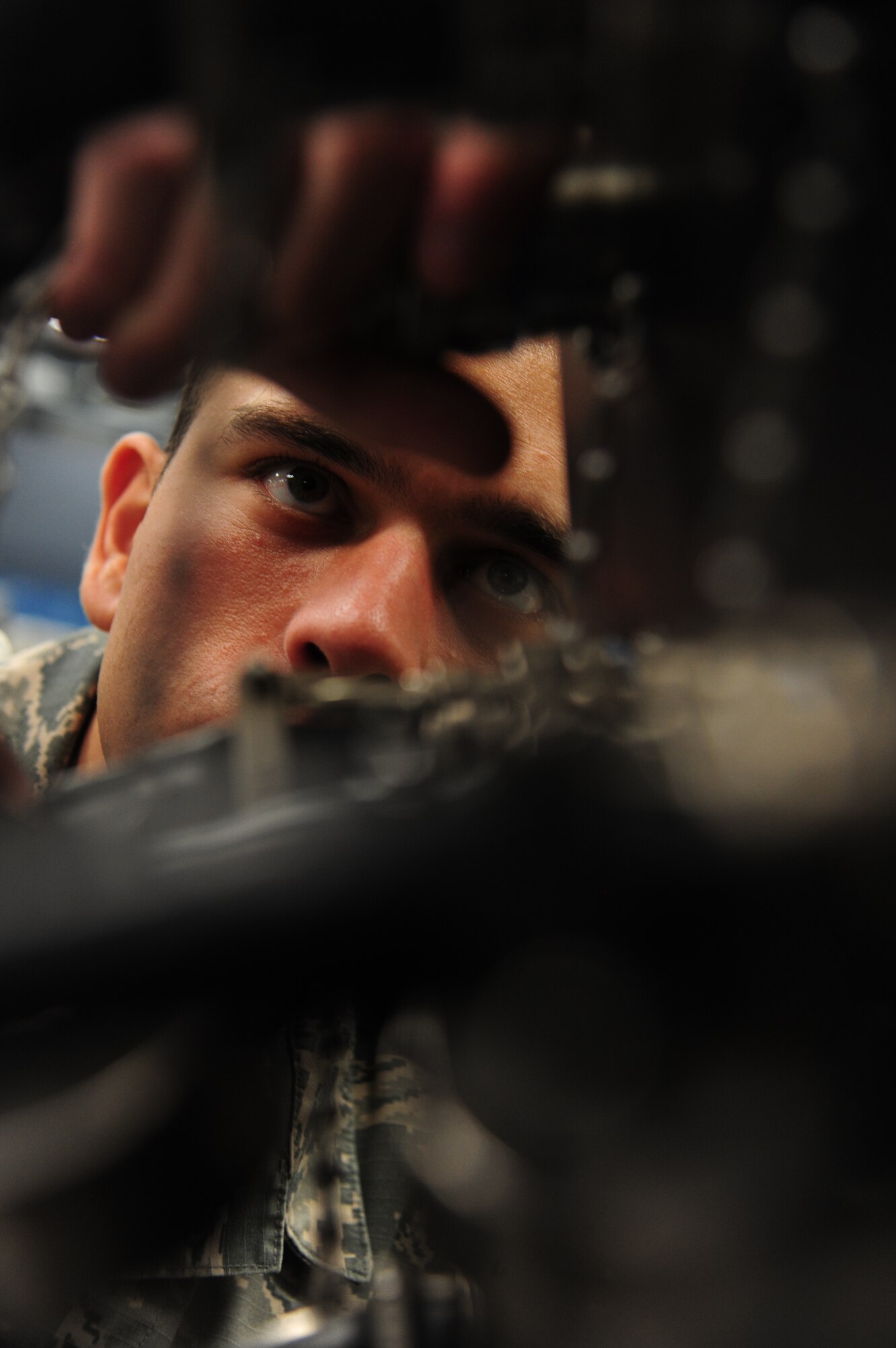 Airman 1st Class Bruno Gomes, 509th Maintenance Squadron avionics technician, connects a cable at Whiteman Air Force Base, Mo., Oct. 1, 2015. This process is done to ensure proper mating between cables and testing interface before conducting tests for the actuator remote terminal. (U.S Air Force photos by Senior Airman Keenan Berry/Released)