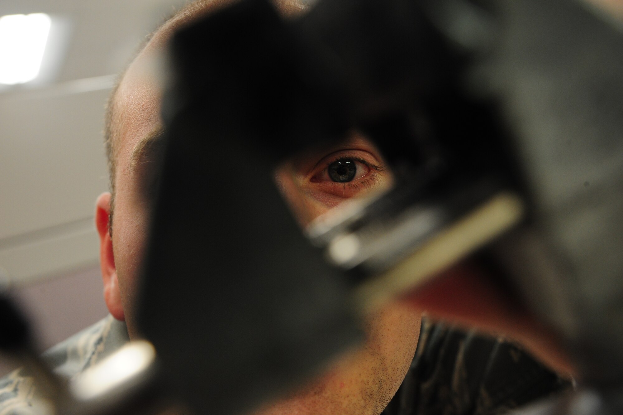 Staff Sgt. Andrew Walch, 509th Maintenance Squadron avionics backshop team leader, examines vice grip at Whiteman Air Force Base, Mo., Oct. 1, 2015. Vice grips are used to help stabilize B-2 Spirit stick grips during maintenance. (U.S Air Force photos by Senior Airman Keenan Berry/Released)