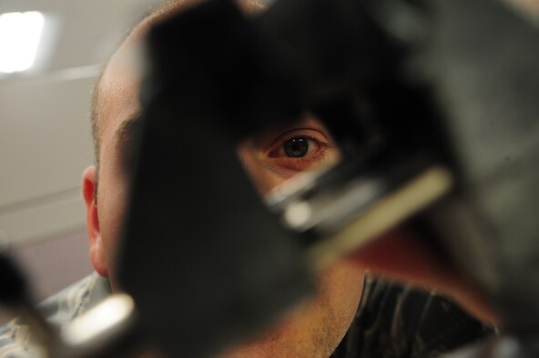 Staff Sgt. Andrew Walch, 509th Maintenance Squadron avionics backshop team leader, examines vice grip at Whiteman Air Force Base, Mo., Oct. 1, 2015. Vice grips are used to help stabilize B-2 Spirit stick grips during maintenance. (U.S Air Force photos by Senior Airman Keenan Berry/Released)
