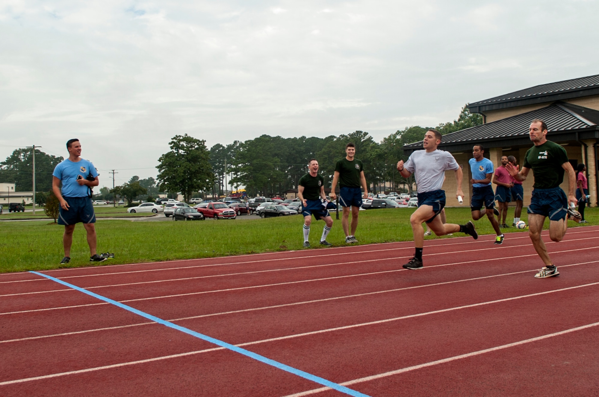 Airmen race to the finish line during a relay race as part of Comprehensive Airman Fitness Day, Sept. 30, 2015, at Seymour Johnson Air Force Base, North Carolina. Airmen competed in various events throughout the day to promote the physical pillar of CAF. (U.S. Air Force photo/Airman Shawna L. Keyes)