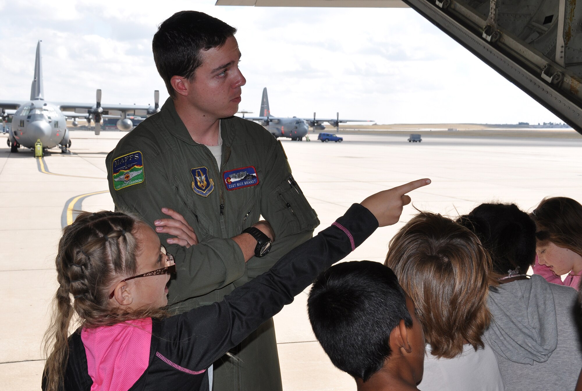 PETERSON AIR FORCE BASE, Colo. –Staff Sgt. Nick Brandt, a C-130 loadmaster with the Air Force Reserve Command’s 302nd Airlift Wing, answers questions about the C-130 Hercules during a tour with Peterson AFB STARBASE students Sept. 29, 2015 here. Twenty-one students spent the afternoon with 302nd AW Airmen to learn about their missions and to tour a C-130 aircraft. According to their official website, “STARBASE students participate in challenging ‘hands-on, mind-on’ activities in Science, Technology, Engineering, and Math. They interact with military personnel to explore careers and observe STEM applications in the real world. The program provides students with 25 hours of experiences at bases across the nation.” (U.S. Air Force photo/Master Sgt. Daniel Butterfield)