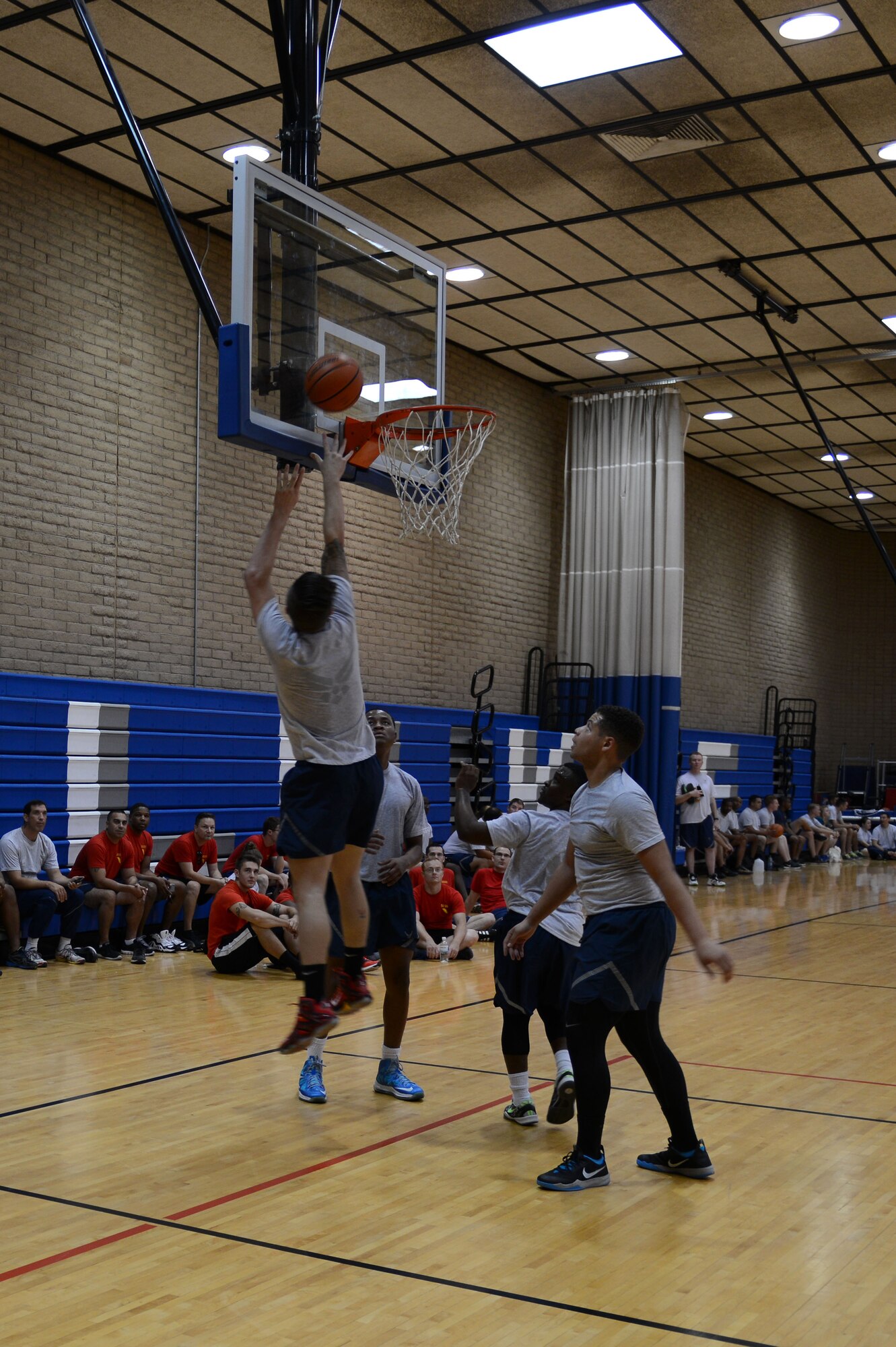 Airman 1st Class Dylan Vogel, 56th Medical Group medical technician, shoots to score during Wingman Day while competing in a 3-on-3 basketball game at Luke Air Force Base, Arizona, Sept. 30, 2015. Wingman Day is a day to bring squadrons together from around the base to build morale and compete in various sports activities. (U.S. Air Force photo by Senior Airman James Hensley)